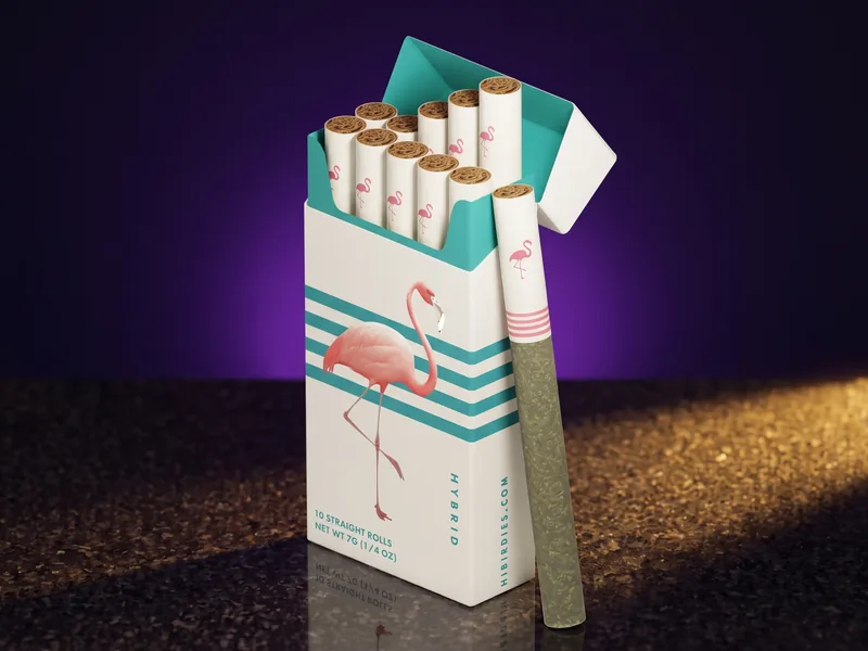 An open white Birdies Classic 10-pack, Hybrid, with teal stripes and a pink flamingo, and one pre-roll leaning on its side, on dark granite.