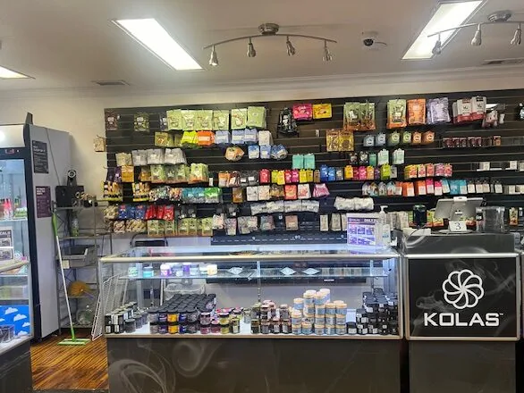The Main Ave counter with KOLAS pinwheel case fronts and a full product wall