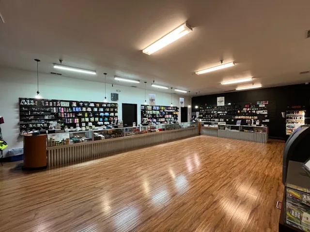 The long South Watt sales room: a wood floor and a counter along the back wall
